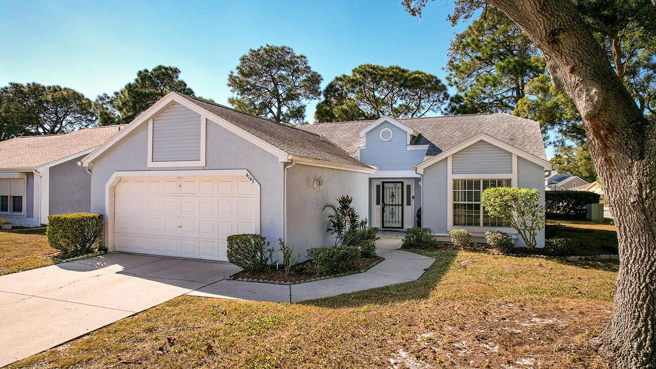 Property front view of 4143 Foxboro Dr, New Port Richey, FL 34653. Video thumbnail.